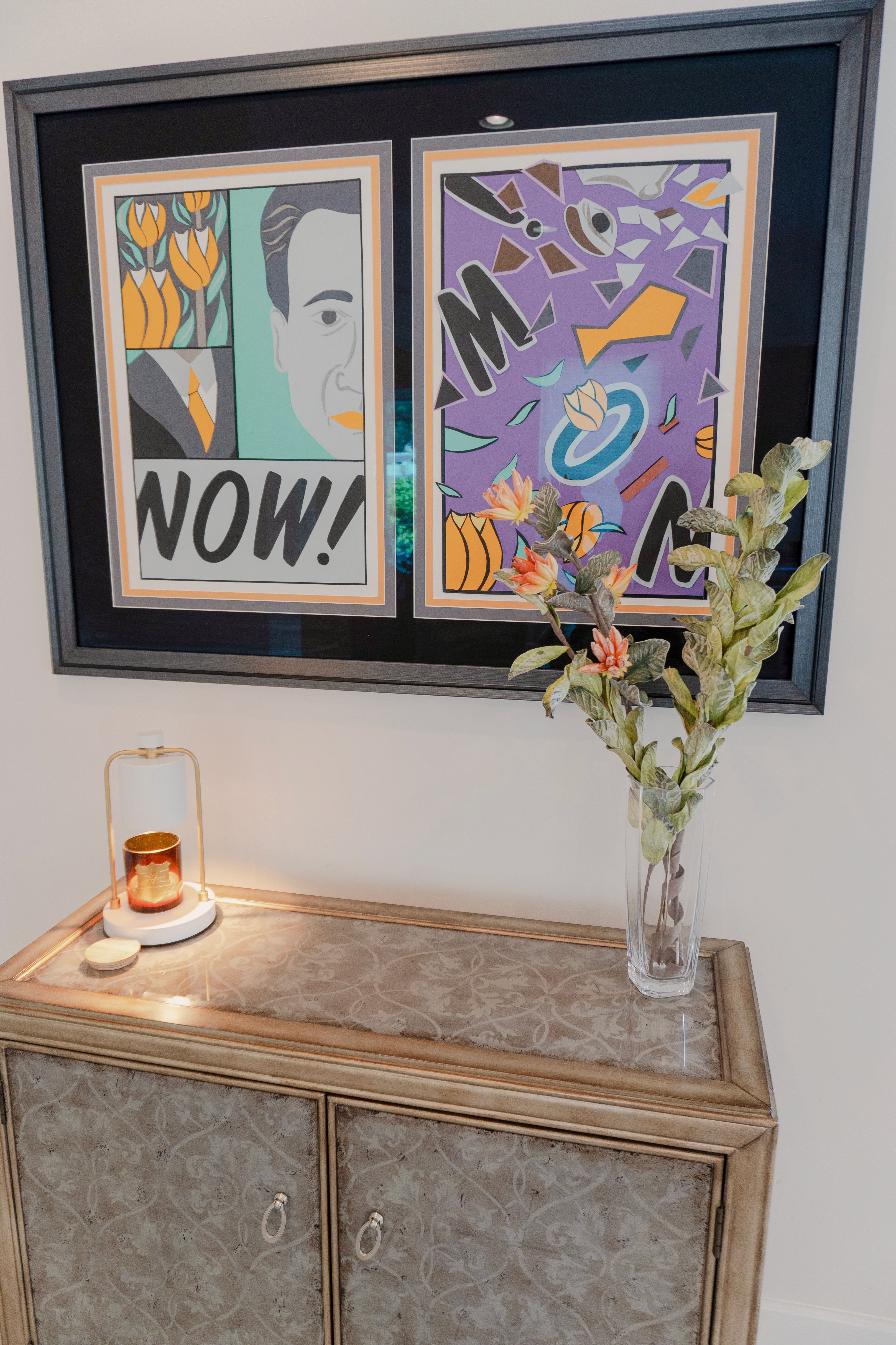 Garden Patio Bridal Suite — console with candle warmer, floral arrangement, and framed pop-art