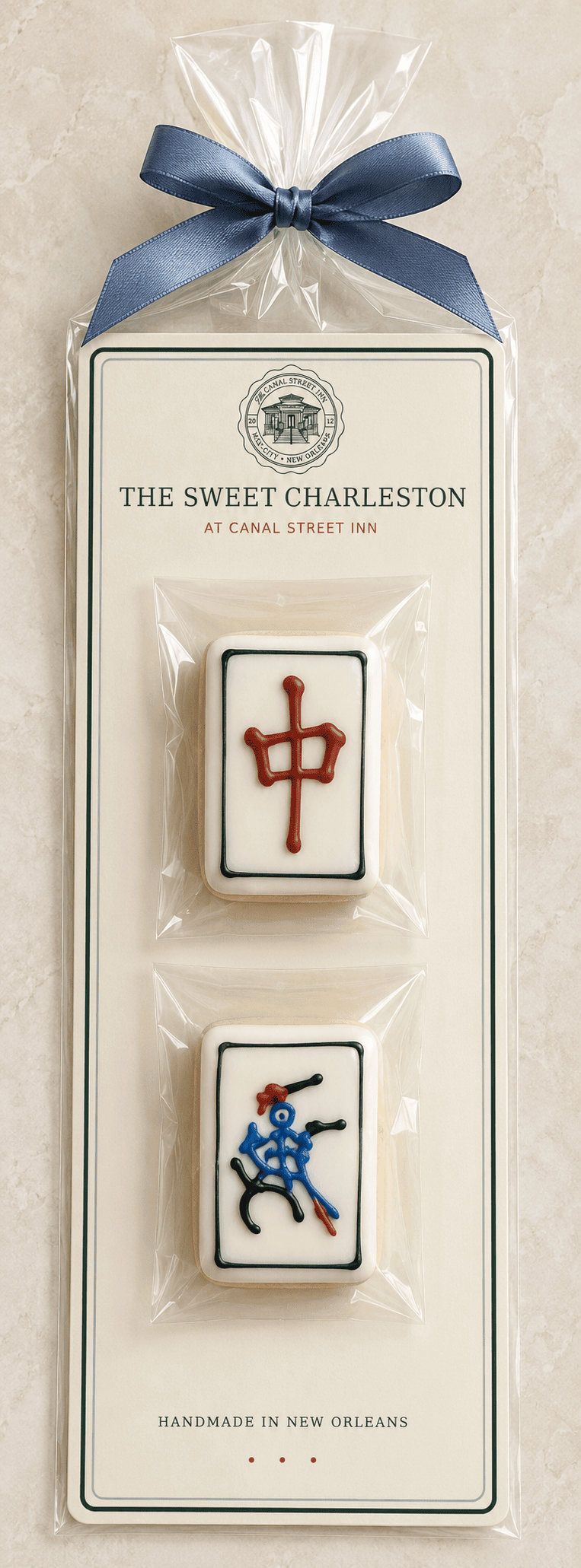 Two individually wrapped Mahjong-tile cookies packaged as The Sweet Charleston at Canal Street Inn